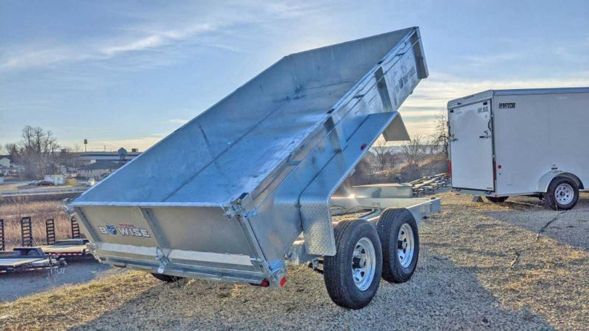 New 2026 BWISE 6'9" x 12 Lo Pro Equipment Dump Trailer - GALVANIZED