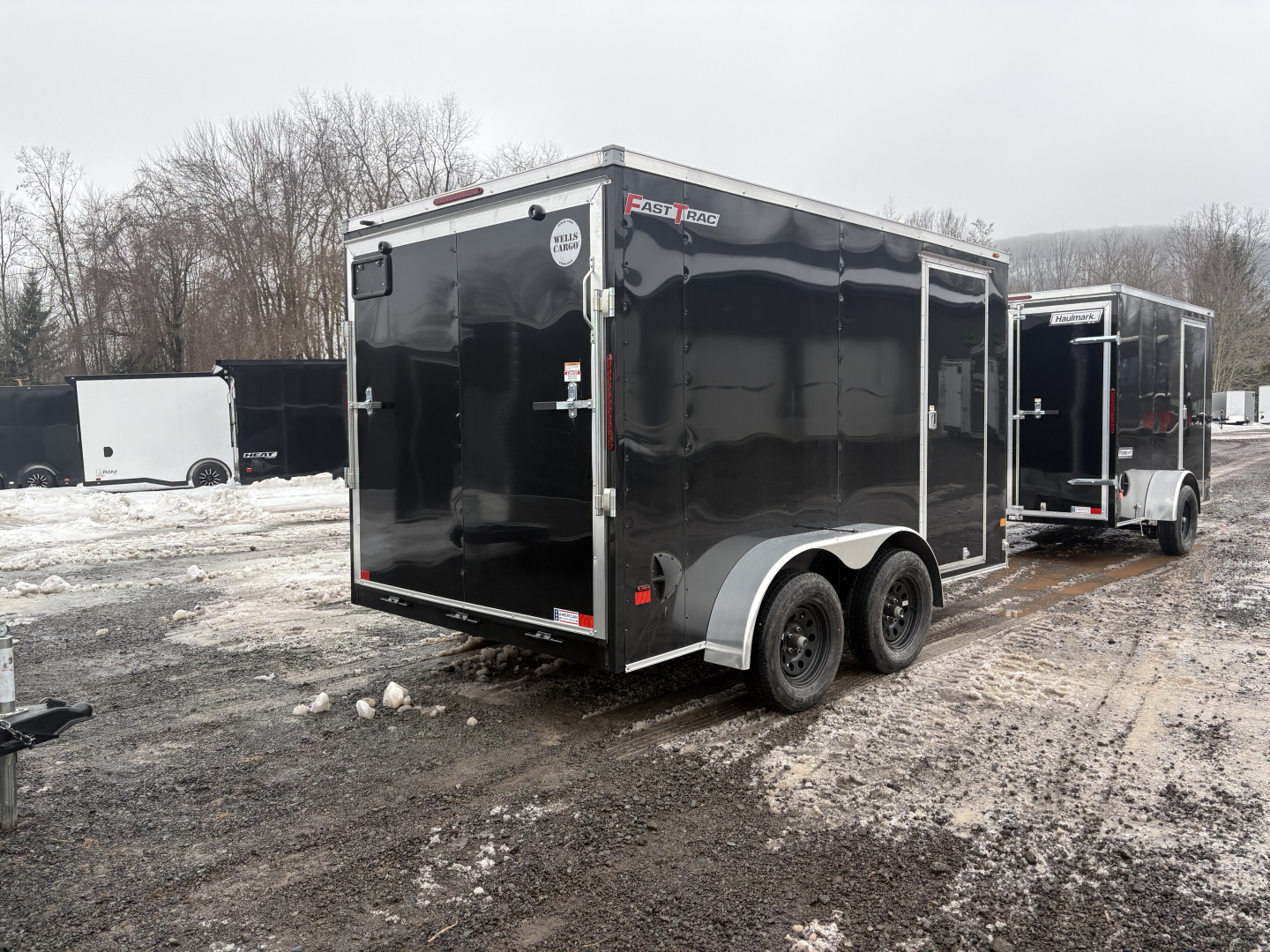 New 2026 WELLS CARGO Fasttrac Deluxe 7x12 7K 6'6" Interior Cargo / Enclosed Trailer with Ramp Door