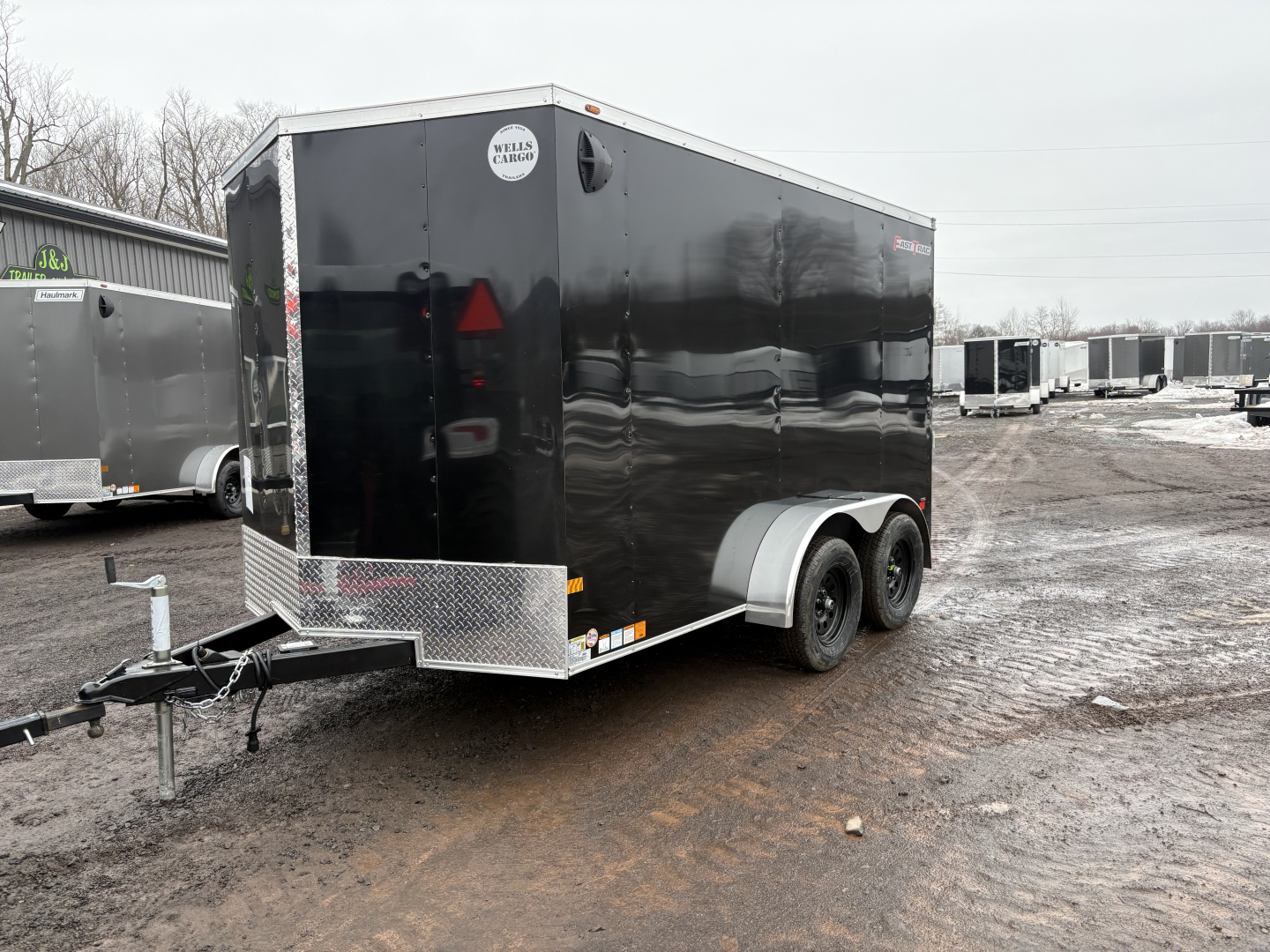New 2026 Wells Cargo Fasttrac Deluxe 7x12 7K 6'6" Interior Cargo / Enclosed Trailer with rear ramp door