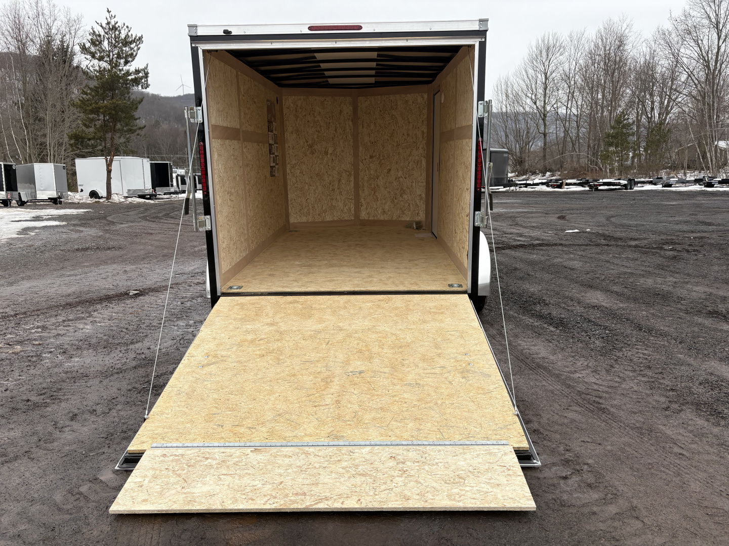 New 2026 Wells Cargo Fasttrac Deluxe 7x12 7K 6'6" Interior Cargo / Enclosed Trailer with rear ramp door