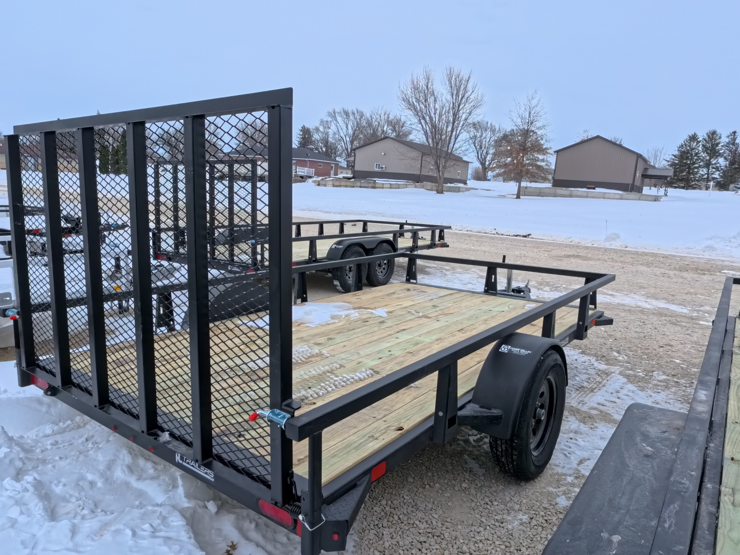New 2026 HTC 7 x 12 Steel Utility Trailer with 2990 lb. GVWR & Anchor Management Post Side Rails - 4 Hole Securing Options