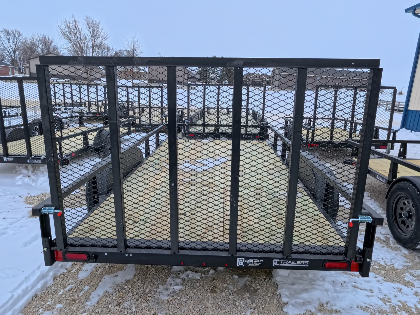 New 2026 HTC 7 x 14 Tandem Axle Utility Trailer includes channel uprights with 4 hole cargo securement options, 7K GVWR