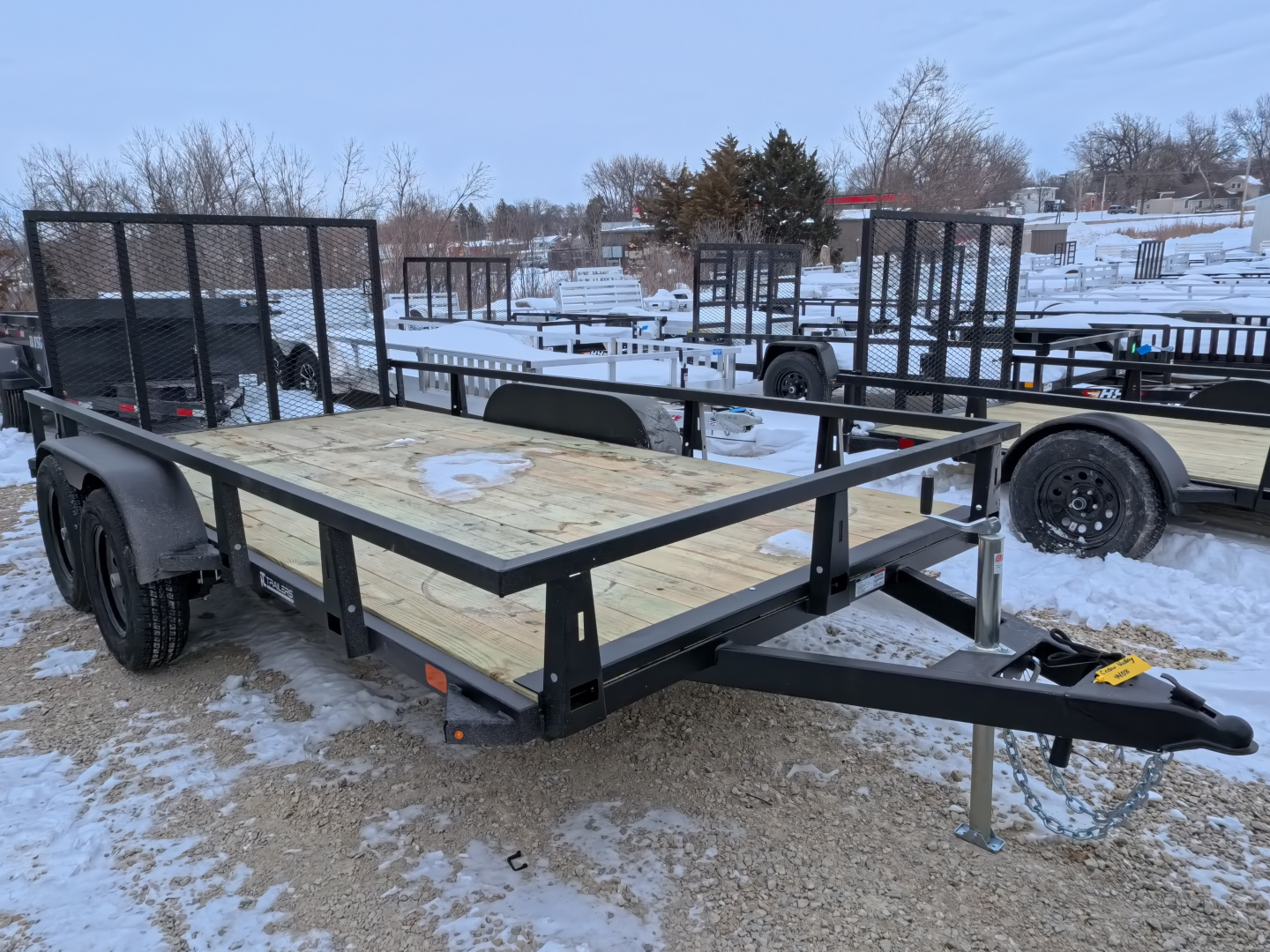 New 2026 HTC 7 x 14 Tandem Axle Utility Trailer includes channel uprights with 4 hole cargo securement options, 7K GVWR