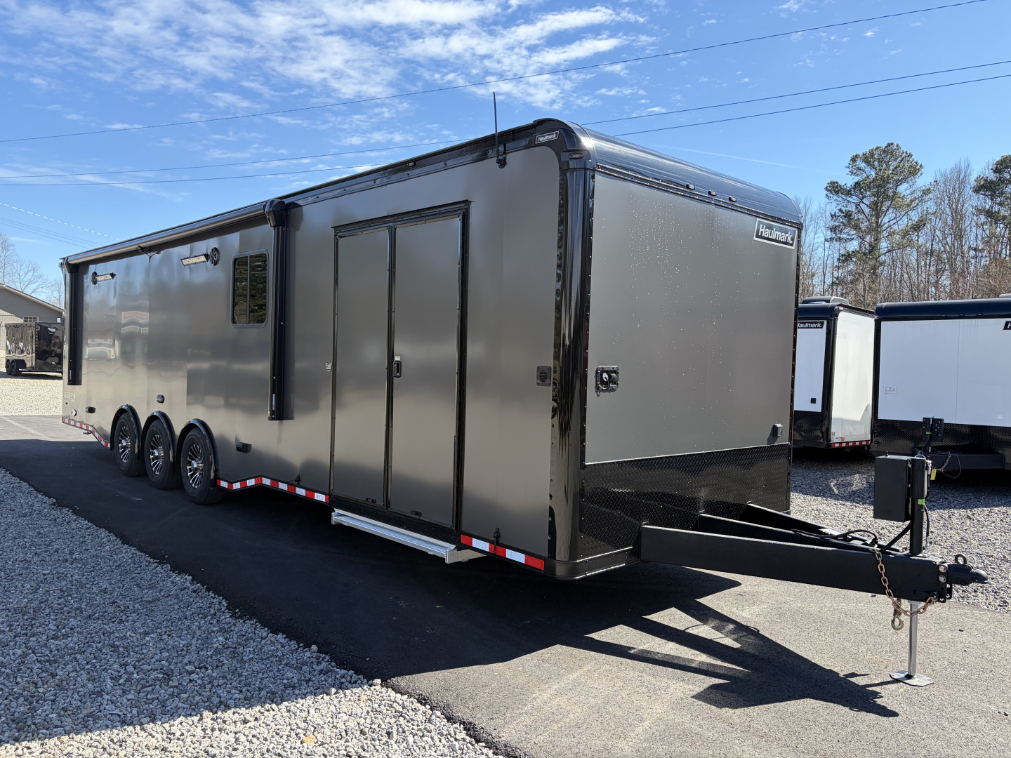 New 2026 Haulmark 34 Bathroom Race Trailer, Air Prep PKG, Awning, Polycor, Insulated, Window, 54" ALX Slide Out Step, A/C + Heat