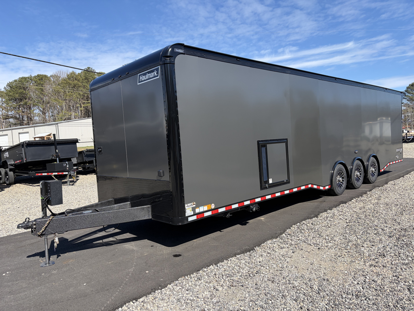 New 2026 Haulmark 34 Bathroom Race Trailer, Air Prep PKG, Awning, Polycor, Insulated, Window, 54" ALX Slide Out Step, A/C + Heat