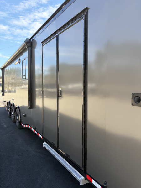 New 2026 Haulmark 34 Bathroom Race Trailer, Air Prep PKG, Awning, Polycor, Insulated, Window, 54" ALX Slide Out Step, A/C + Heat