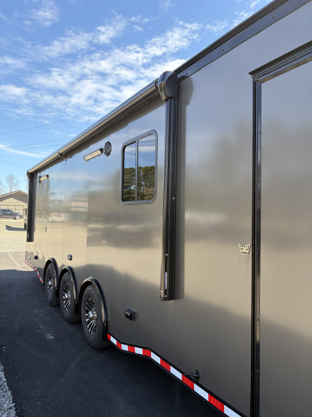 New 2026 Haulmark 34 Bathroom Race Trailer, Air Prep PKG, Awning, Polycor, Insulated, Window, 54" ALX Slide Out Step, A/C + Heat