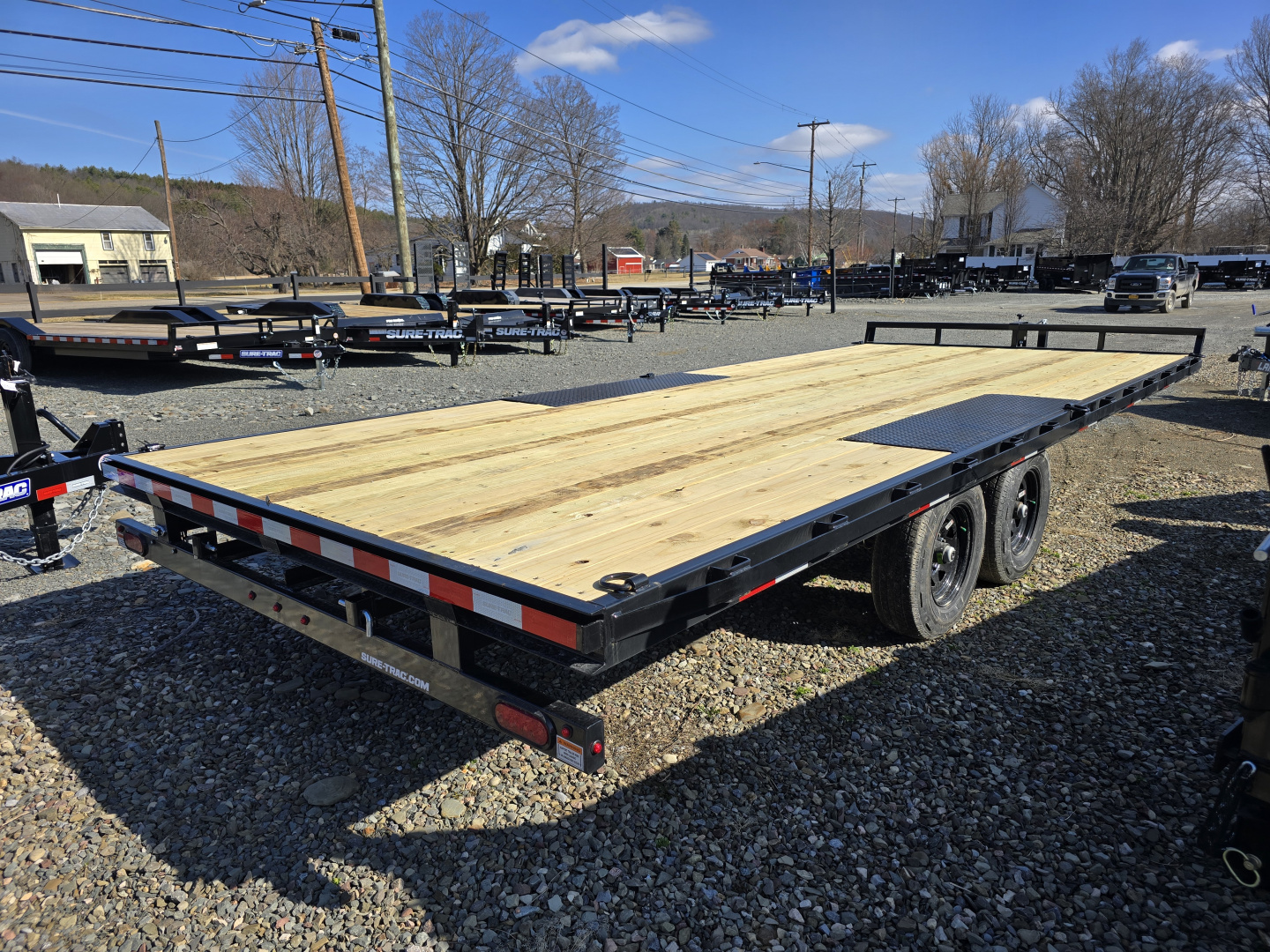 New 2026 Sure-Trac 8.5x20 10K Low Profile Flatbed Deckover- HD Tube Bulkhead- Diamond Plate Deckover Wheels- Stake Pockets and Rub Rails- Spare Tire Carrier- Pressure Treated Decking