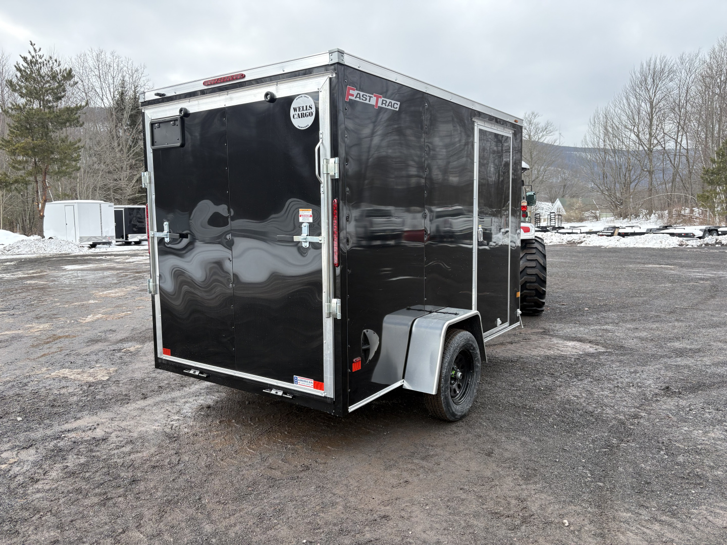 New 2026 WELLS CARGO 6x10 6'6" Interior Height Fasttrac Deluxe Cargo / Enclosed Trailer w/Ramp Door