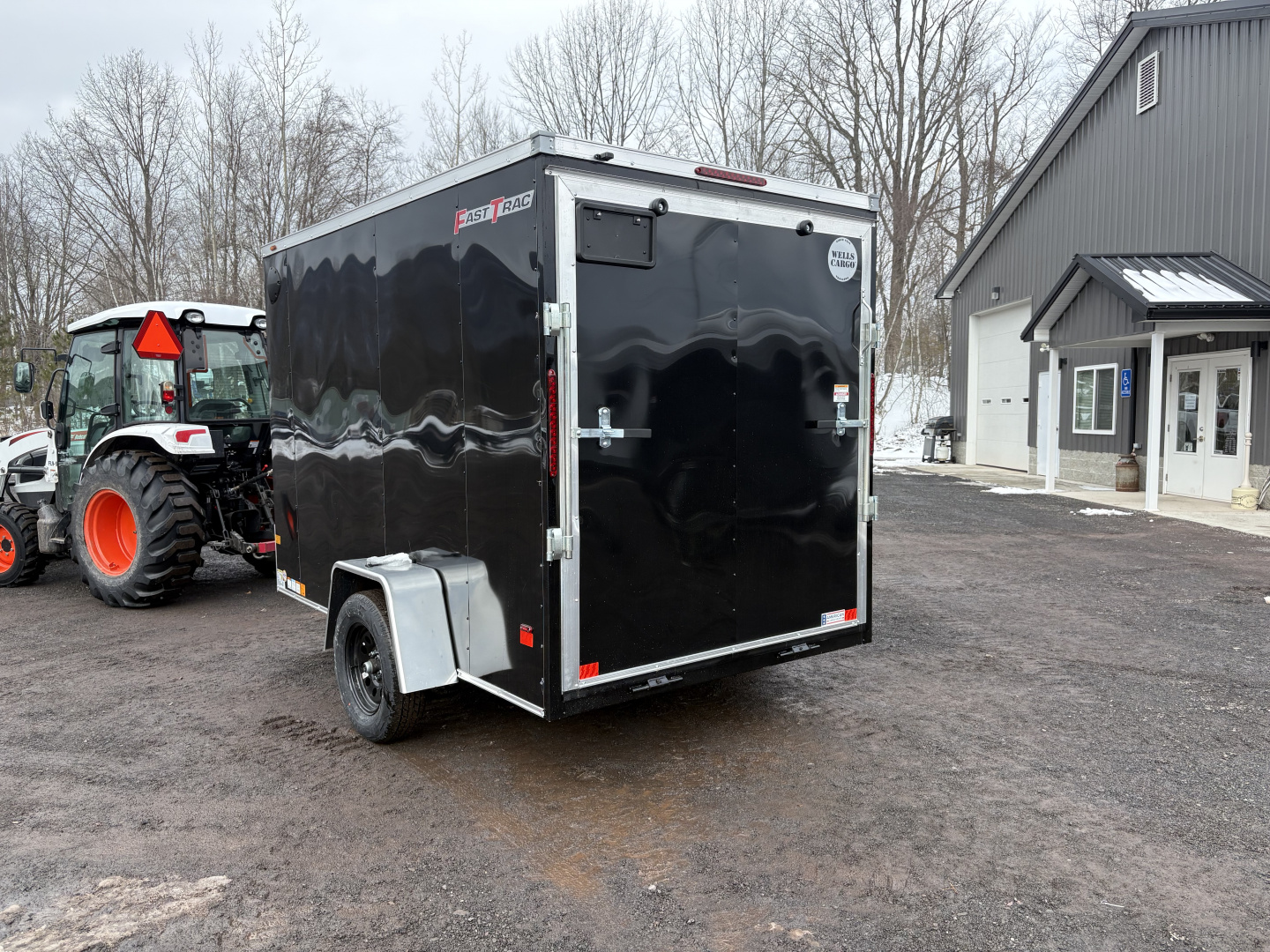 New 2026 WELLS CARGO 6x10 6'6" Interior Height Fasttrac Deluxe Cargo / Enclosed Trailer w/Ramp Door
