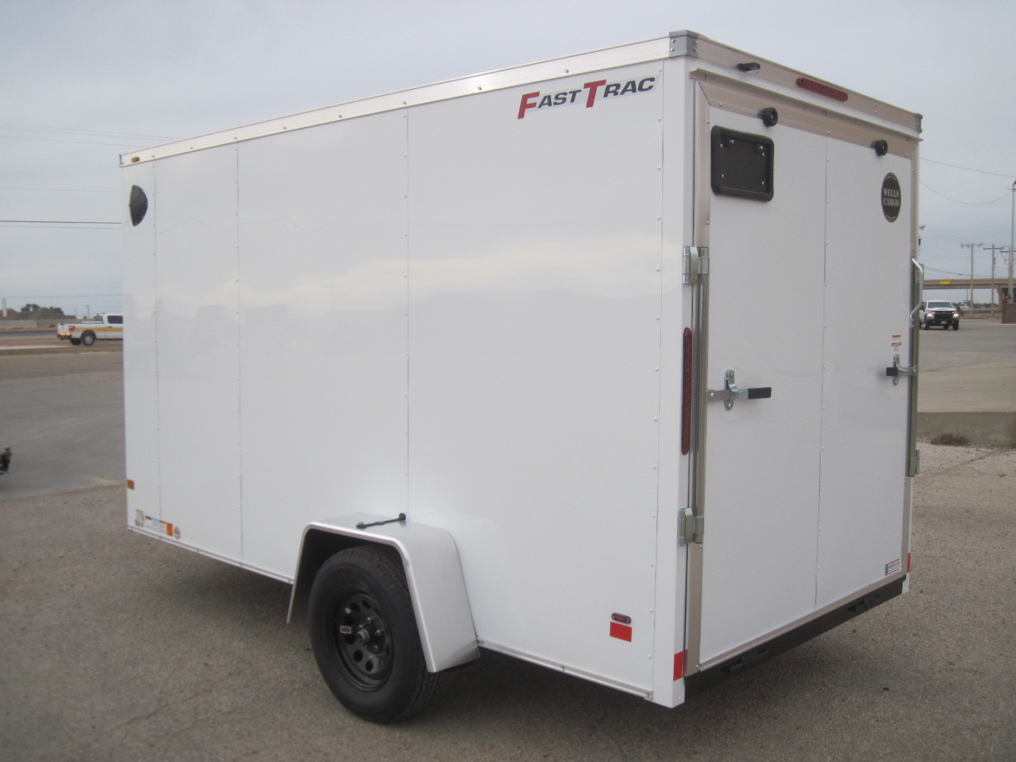 New 2026 Wells Cargo 6x12x6.5 FastTrac Deluxe Cargo w/ Ramp