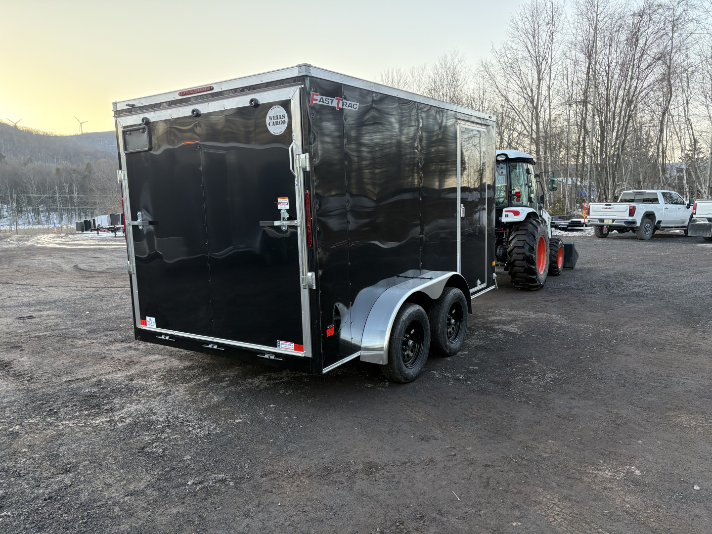 New 2026 WELLS CARGO Fasttrac Deluxe 7x12 7K 6'6" Interior Height Cargo / Enclosed Trailer with Ramp Door