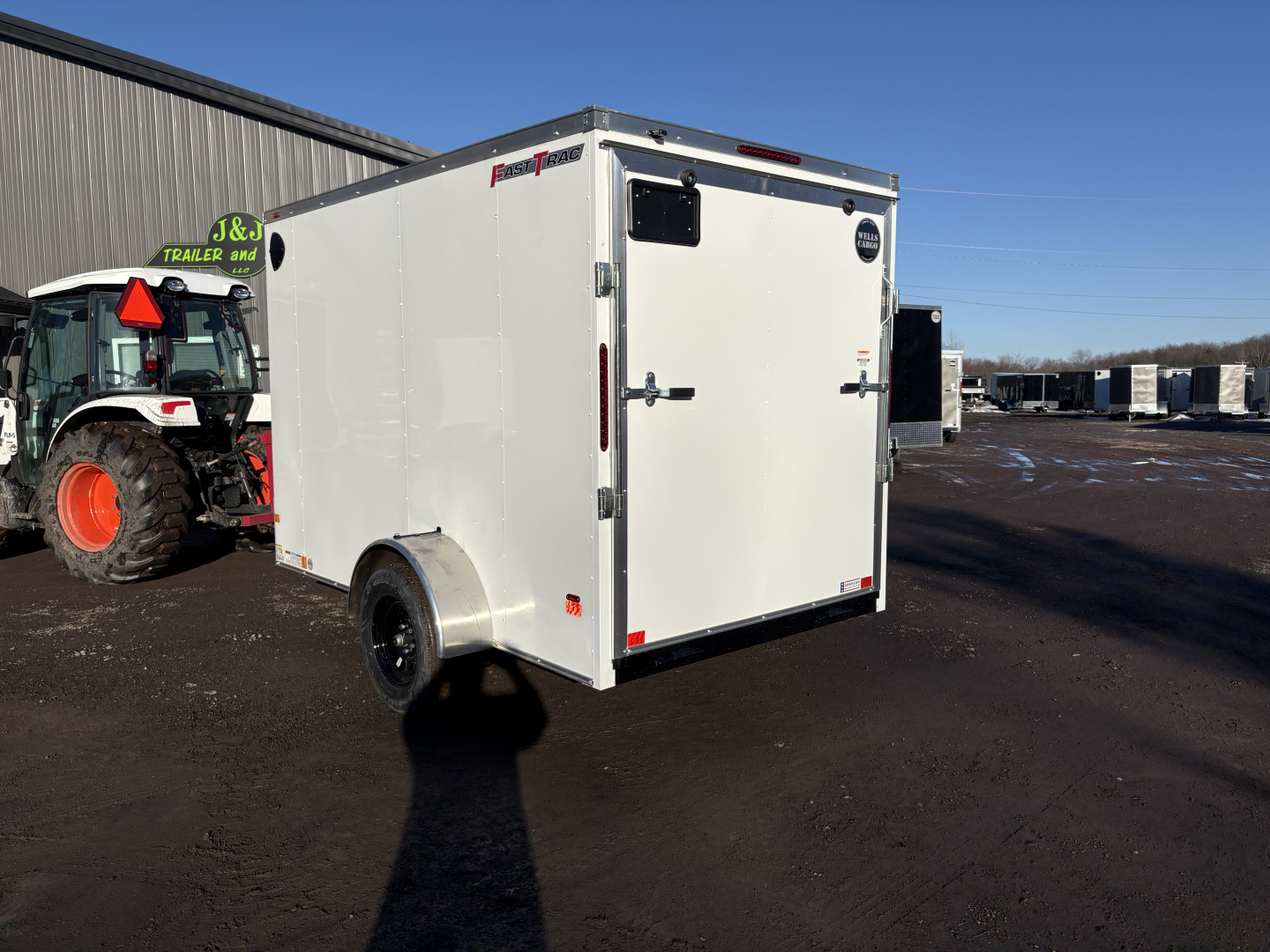 New 2026 WELLS CARGO 6x10 6'6" Interior Height Fasttrac Deluxe Cargo / Enclosed Trailer w/Ramp Door