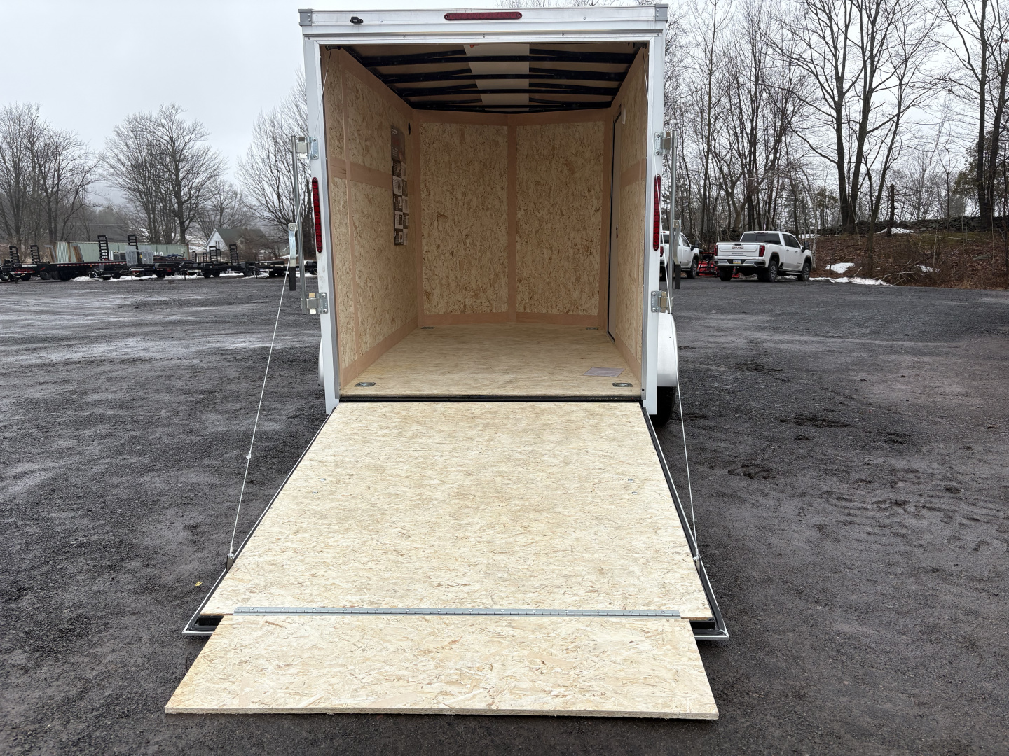 New 2026 Haulmark 6x10 6'6" Interior Passport Deluxe Cargo / Enclosed Trailer with Ramp Door