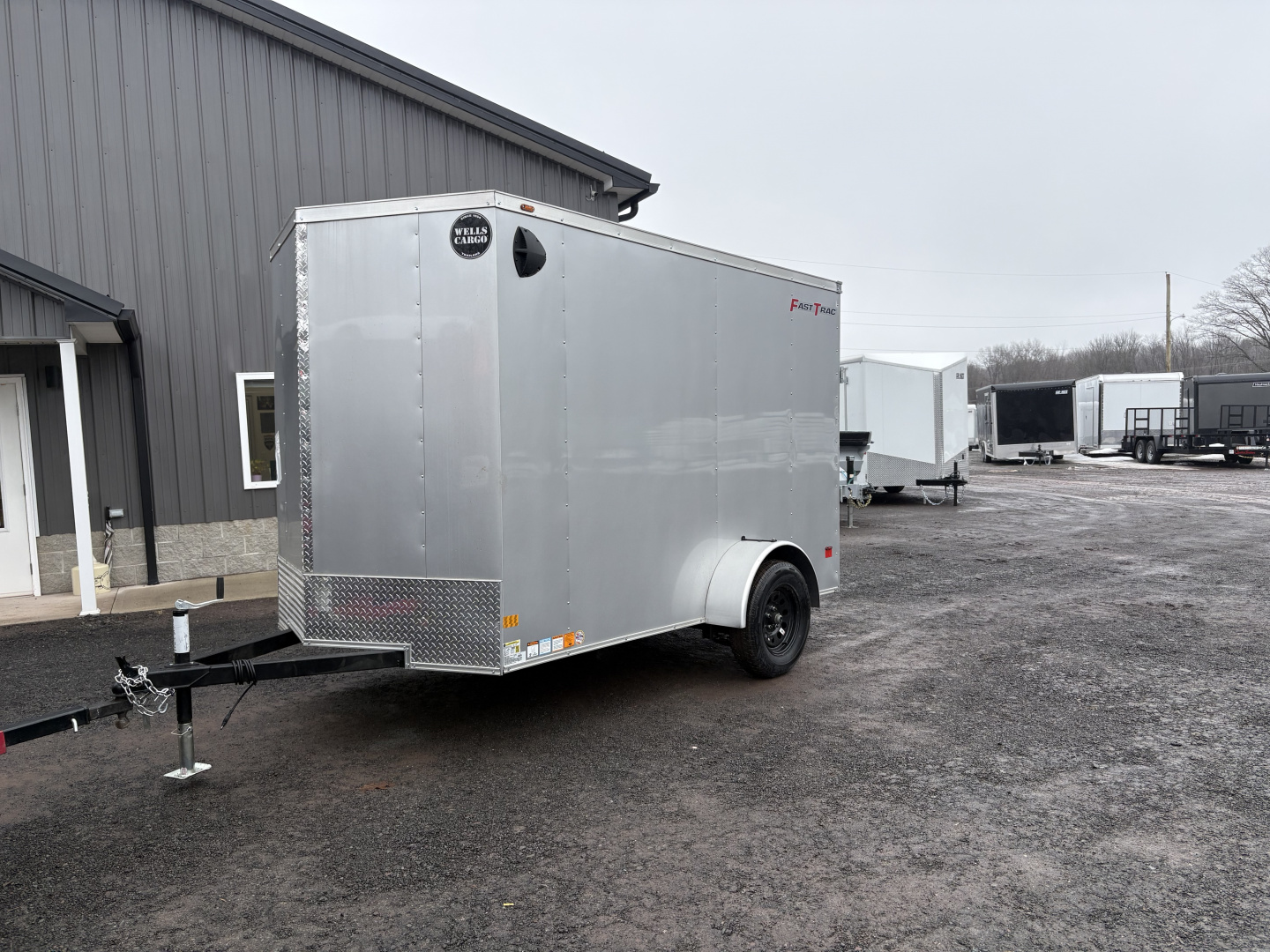 New 2026 Wells Cargo 6x10 6'6" Interior Fasttrac Deluxe Cargo / Enclosed Trailer with Ramp Door