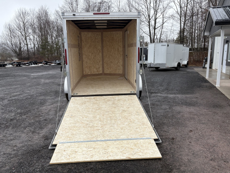 New 2026 Wells Cargo 6x10 6'6" Interior Fasttrac Deluxe Cargo / Enclosed Trailer with Ramp Door