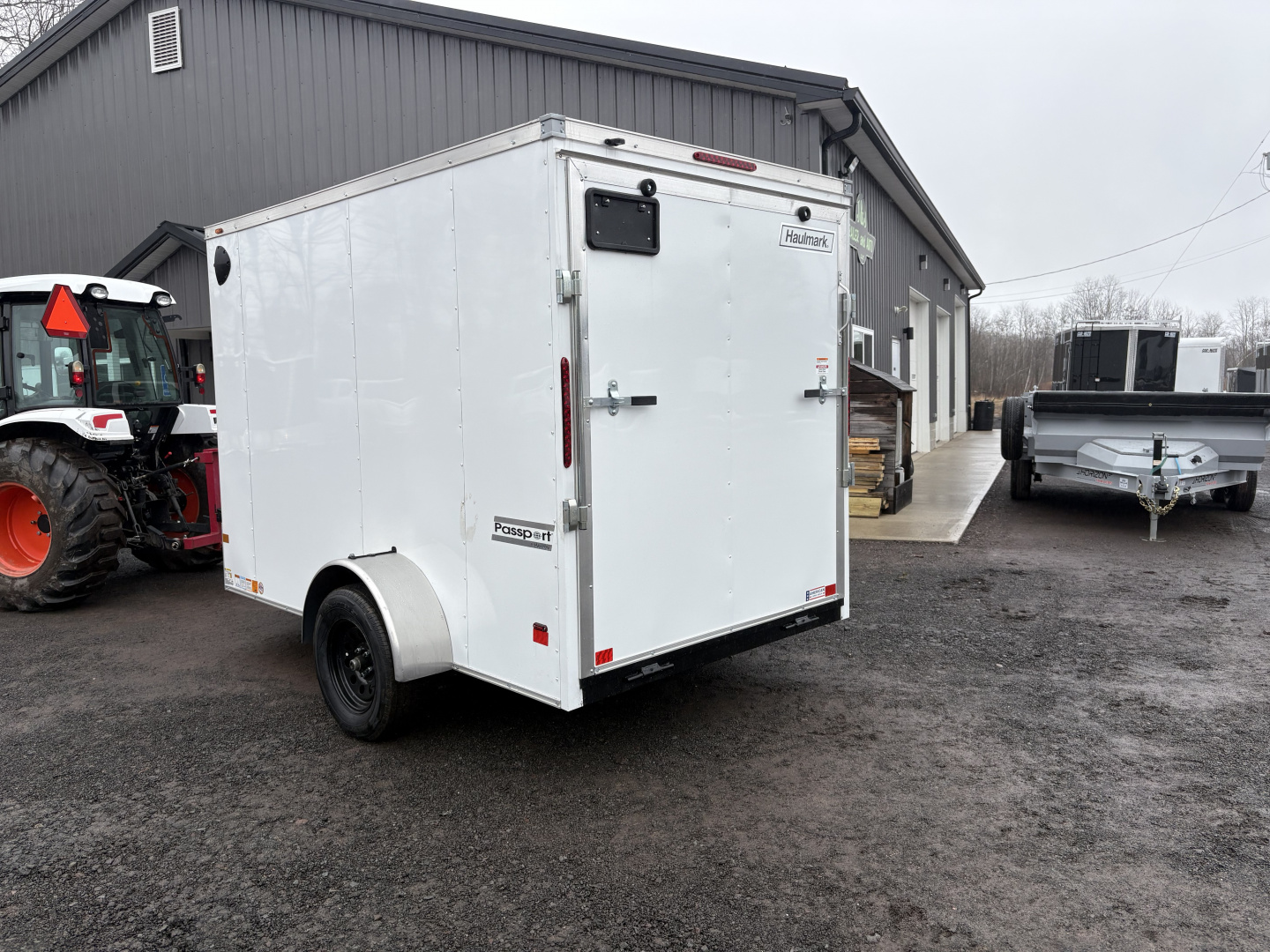 New 2026 Haulmark 6x10 6'6" Interior Passport Deluxe Cargo / Enclosed Trailer with Ramp Door