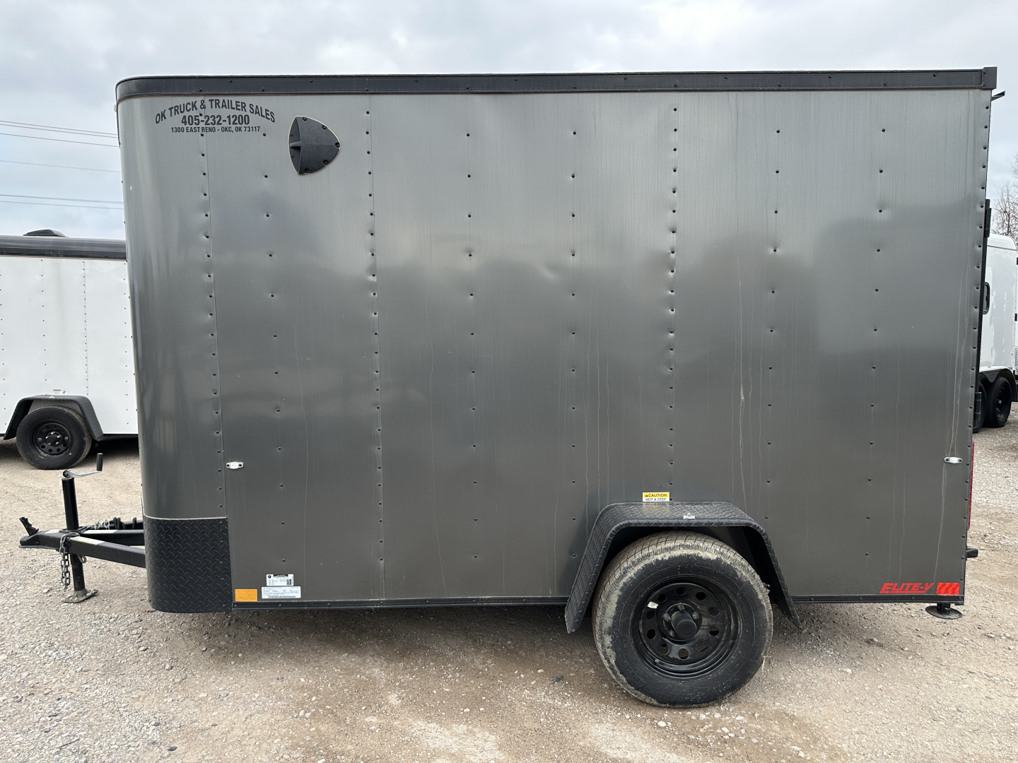New 2025 Cargo Craft 6'x12'x6'6" Elite V Nose Sport with Ramp door in White / Black out Cargo / Enclosed Trailer