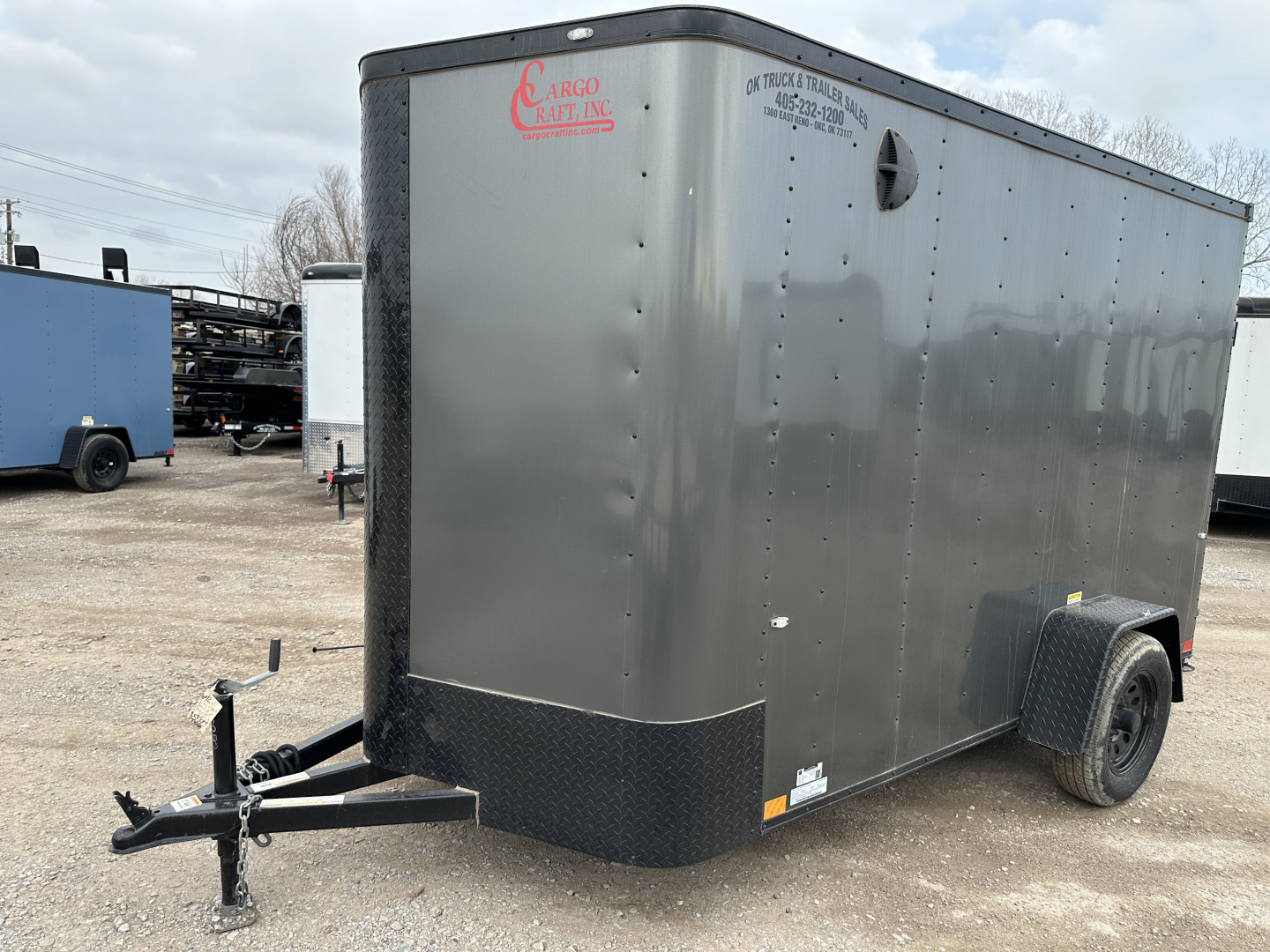 New 2025 Cargo Craft 6'x12'x6'6" Elite V Nose Sport with Ramp door in White / Black out Cargo / Enclosed Trailer