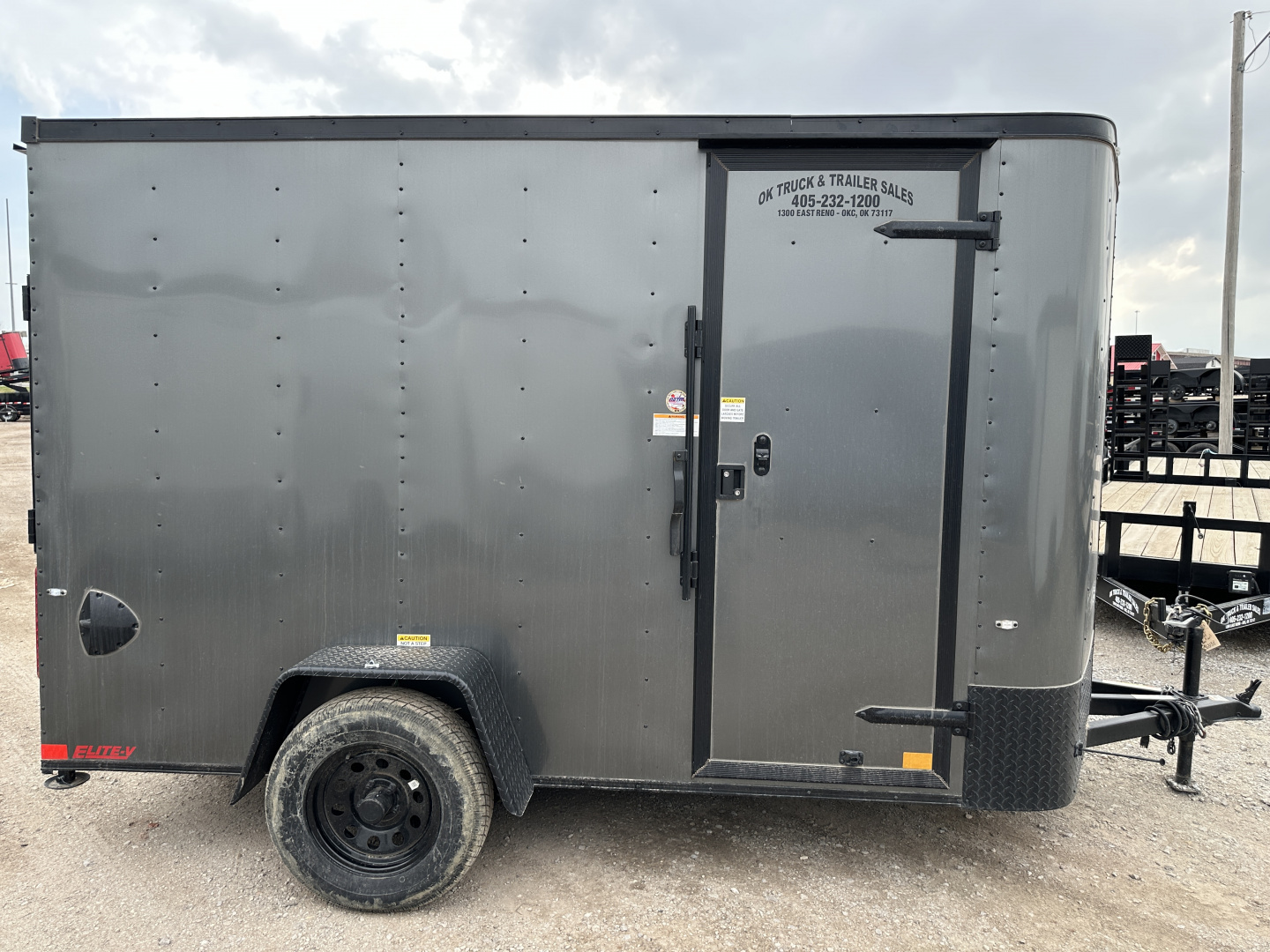 New 2025 Cargo Craft 6'x12'x6'6" Elite V Nose Sport with Ramp door in White / Black out Cargo / Enclosed Trailer