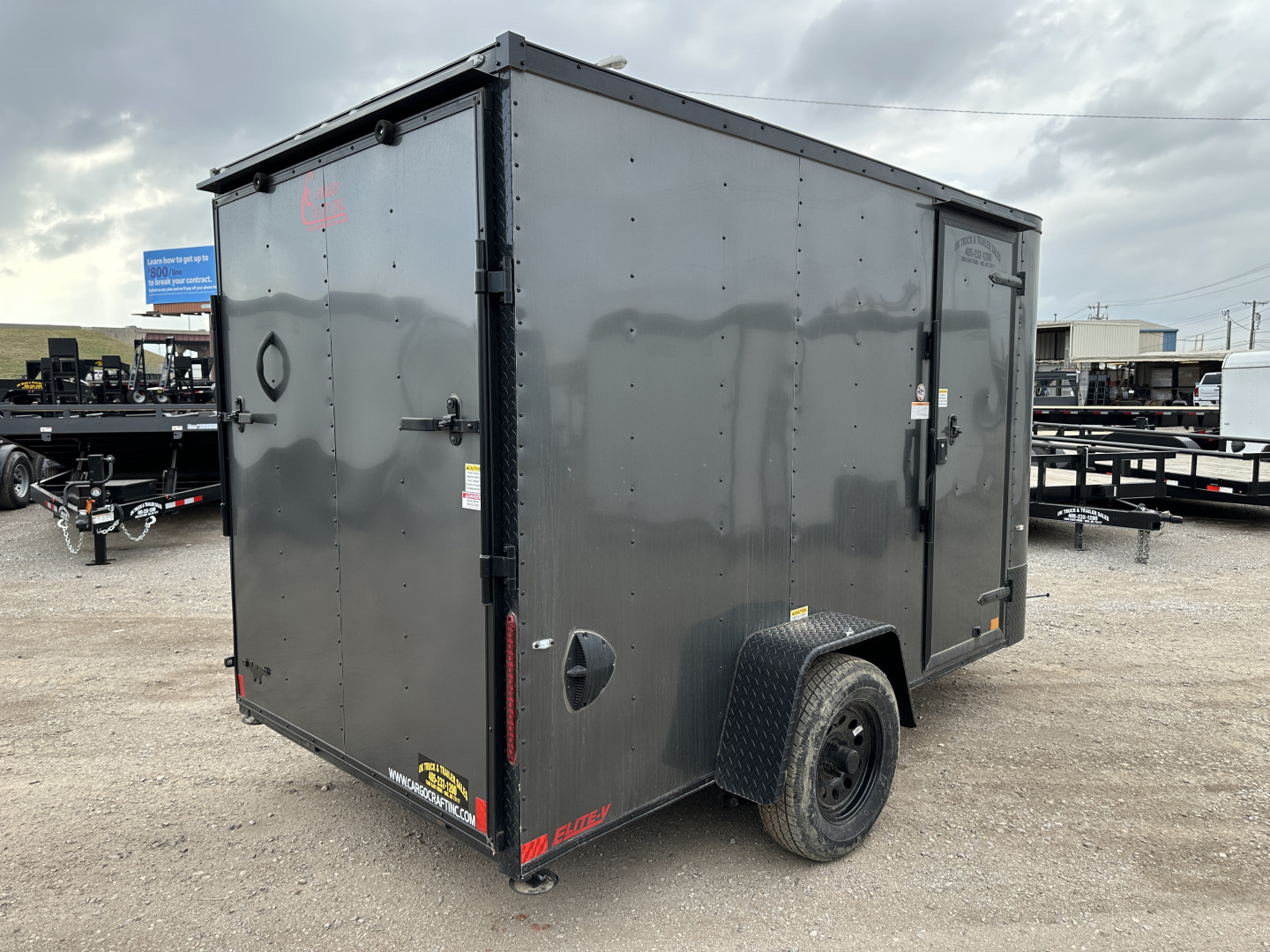 New 2025 Cargo Craft 6'x12'x6'6" Elite V Nose Sport with Ramp door in White / Black out Cargo / Enclosed Trailer