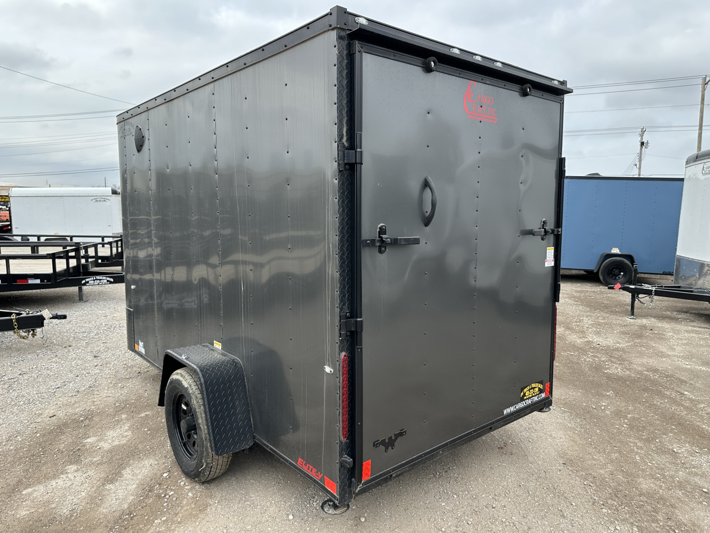 New 2025 Cargo Craft 6'x12'x6'6" Elite V Nose Sport with Ramp door in White / Black out Cargo / Enclosed Trailer