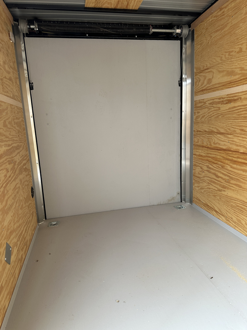 New 2025 Cargo Craft 6'x12'x6'6" Elite V Nose Sport with Ramp door in White / Black out Cargo / Enclosed Trailer