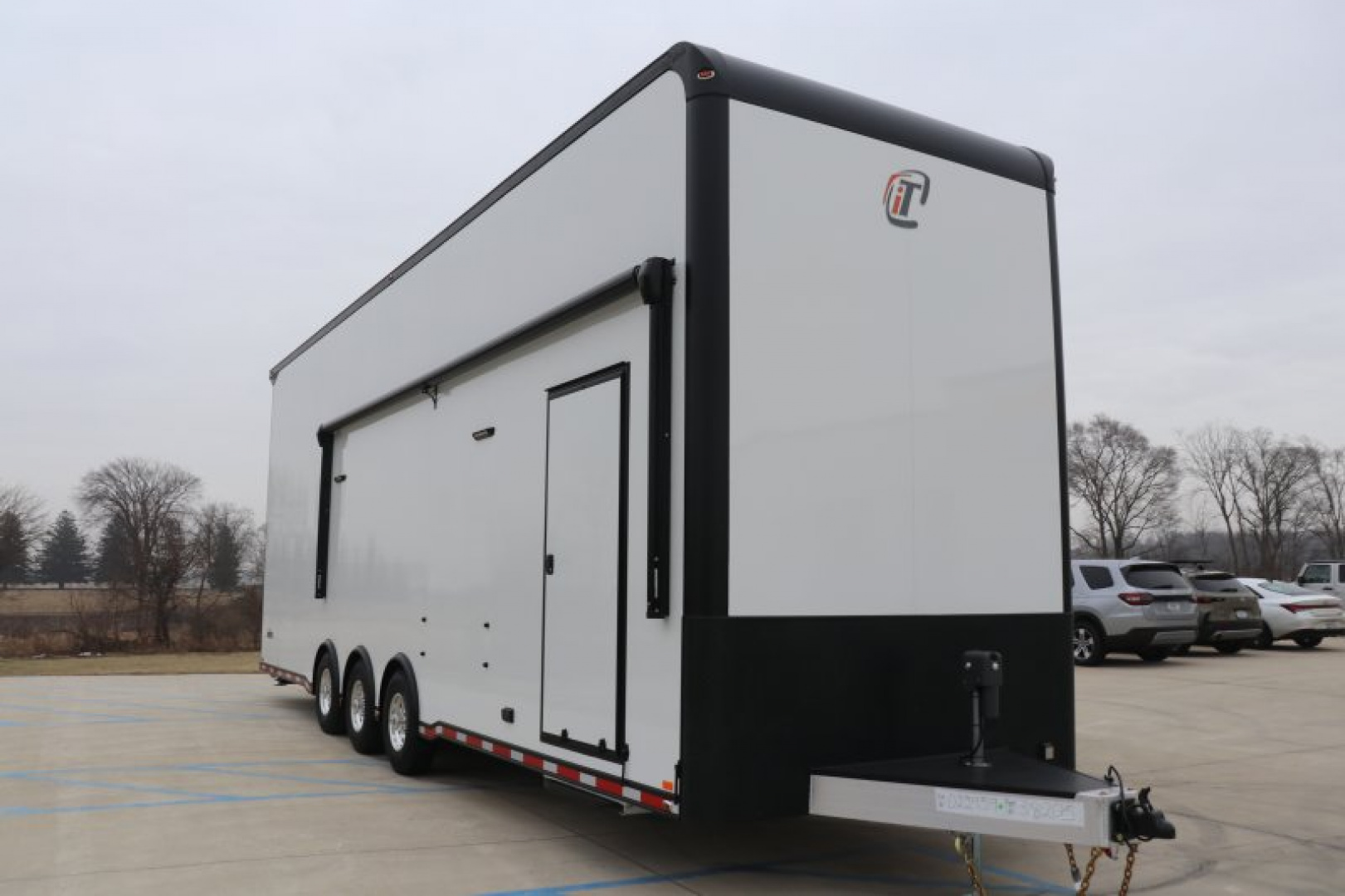 New In-Tech Lite 8.5x32 Stacker Race Trailer-21K- White W/ Black Trim, Escape Door, WW Cabinet, RS Cabinet, & Winch