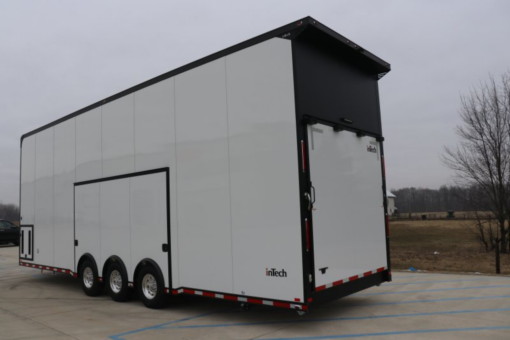 New In-Tech Lite 8.5x32 Stacker Race Trailer-21K- White W/ Black Trim, Escape Door, WW Cabinet, RS Cabinet, & Winch