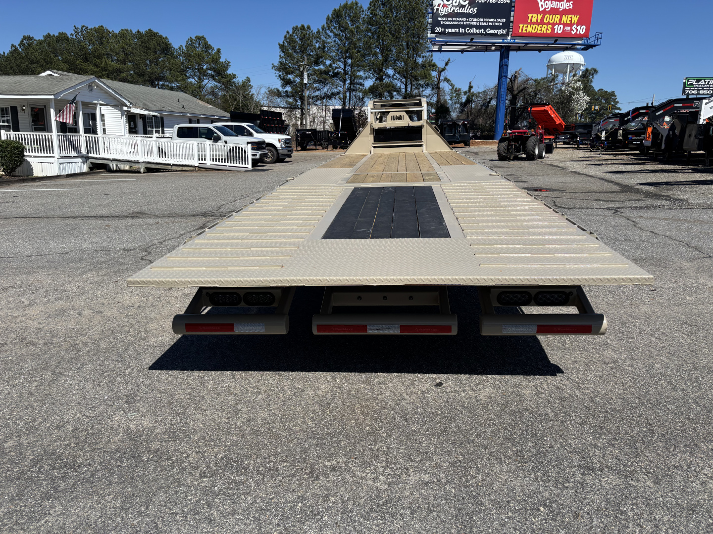 New 2026 RawMaxx HTX 102X32 Flatbed Trailer / SOLAR PANEL / WIRELESS REMOTE / 12" OC / 18 PLY TIRES / ELE./HYD. DISC BRAKES / 32K GVWR