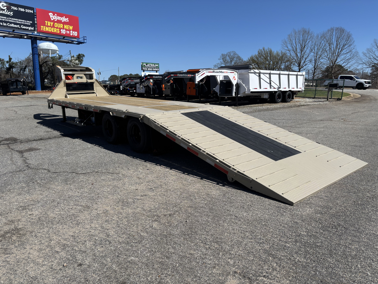 New 2026 RawMaxx HTX 102X32 Flatbed Trailer / SOLAR PANEL / WIRELESS REMOTE / 12" OC / 18 PLY TIRES / ELE./HYD. DISC BRAKES / 32K GVWR