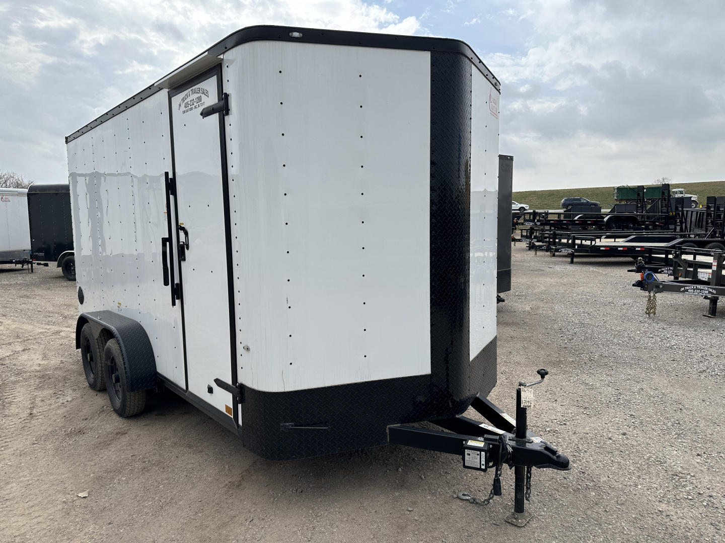New 2025 Cargo Craft 7'x16'x7'tall, Elite V Nose with a ramp door & white/black out Cargo / Enclosed Trailer
