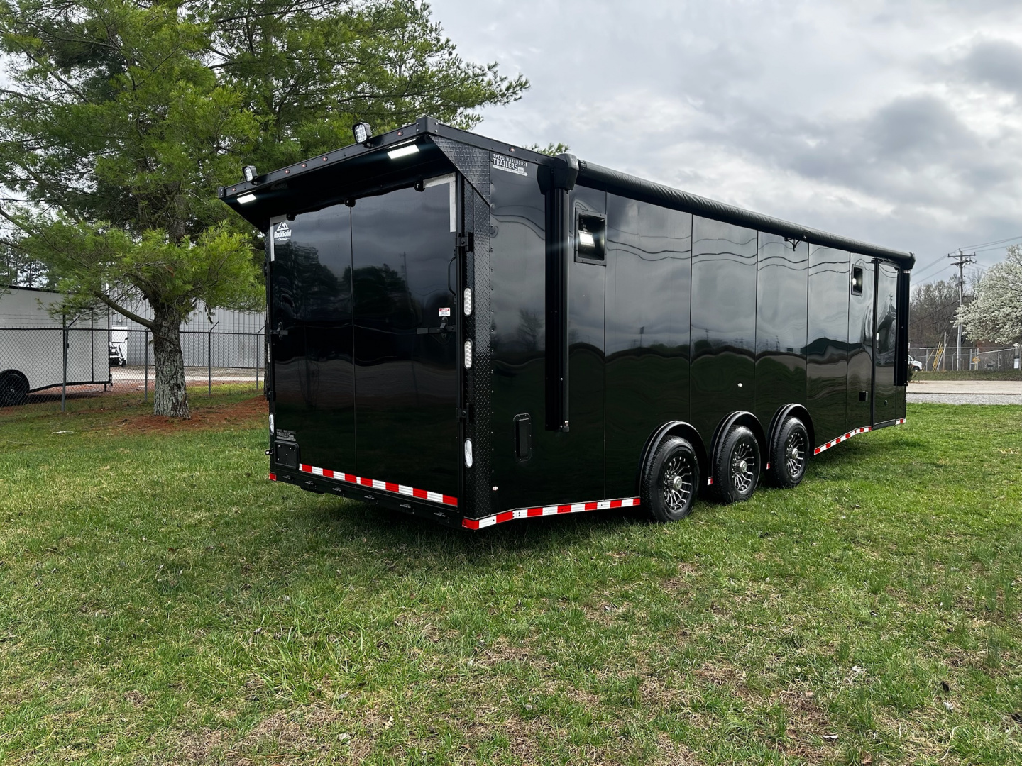 New 2026 Rock Solid Cargo 8.5x28 Race Trailer -Finished Interior-7000LB Triple Torsion-HD Ramp-Awning-GEN. Box-1/2 Outdoor Carpet Walls