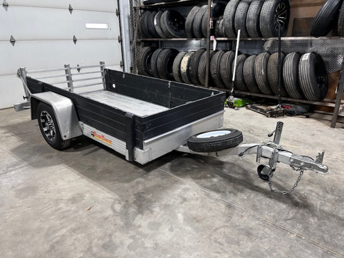 Used 2017 Bear Track 53"X96" ALUMINUM W BI-FOLD GATE 2,100 GVWR Utility Trailer