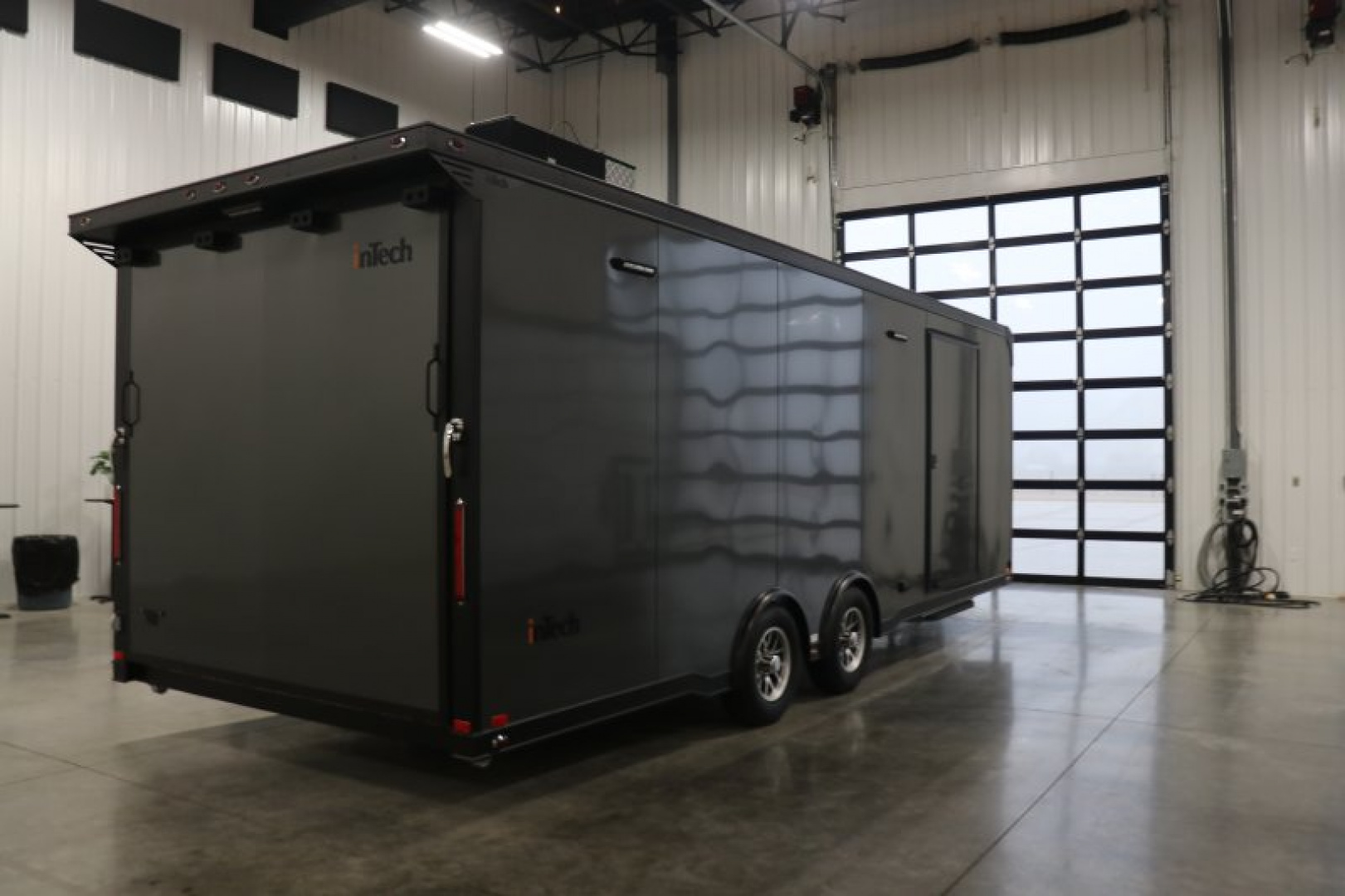 New In-Tech Lite 8.5x24 Race Trailer-10K Charcoal W/ Black Trim- L Base Cabinet, Generator Door, Tool Drawers, & WW Cabinet