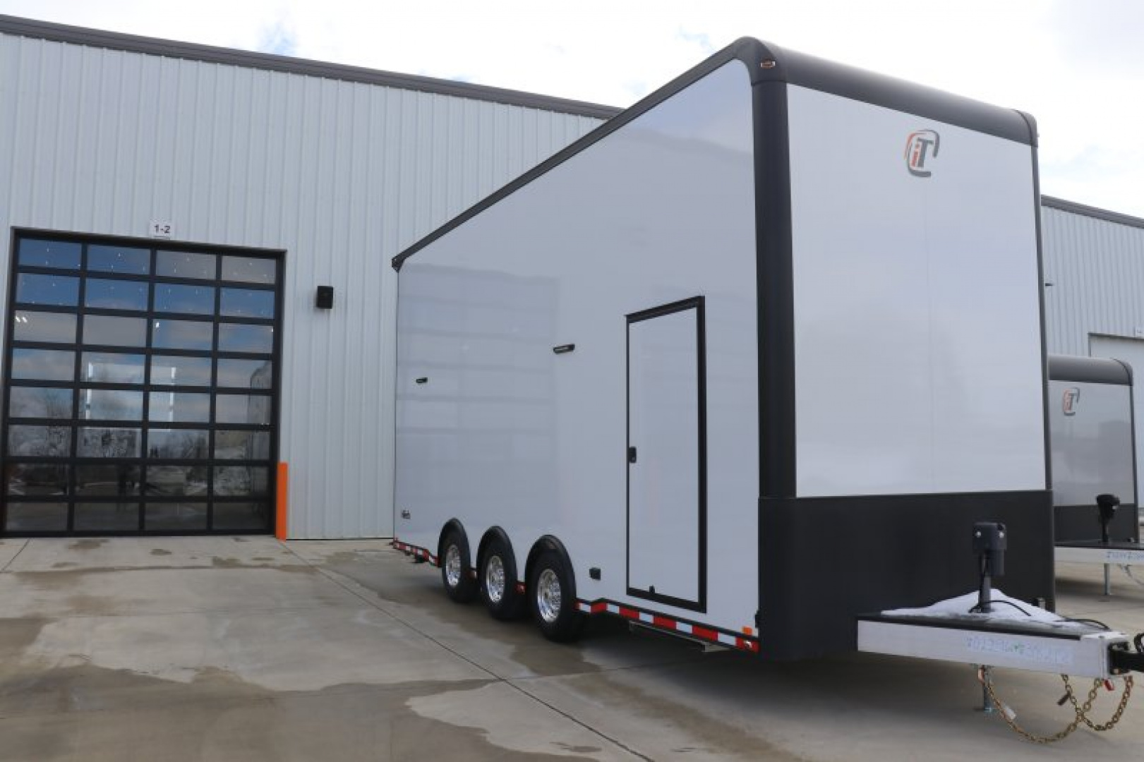 New In-Tech Lite 8.5x24 Stacker Race Trailer-18K - White W/ Black Trim, Tool Drawers, Winch, Airline Track, Full Escape Door, .050 Upgrade & WW Cabinet