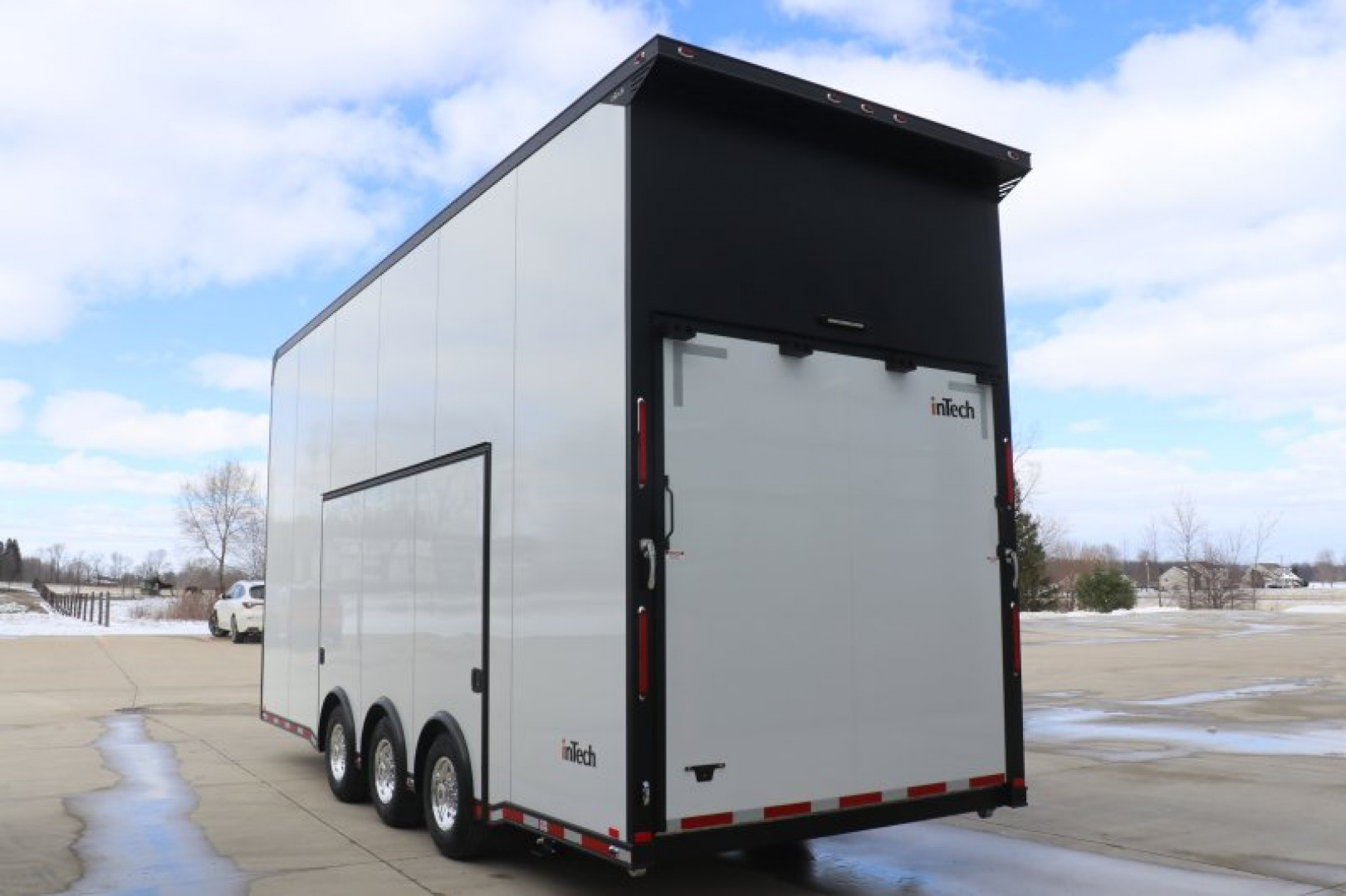 New In-Tech Lite 8.5x24 Stacker Race Trailer-18K - White W/ Black Trim, Tool Drawers, Winch, Airline Track, Full Escape Door, .050 Upgrade & WW Cabinet