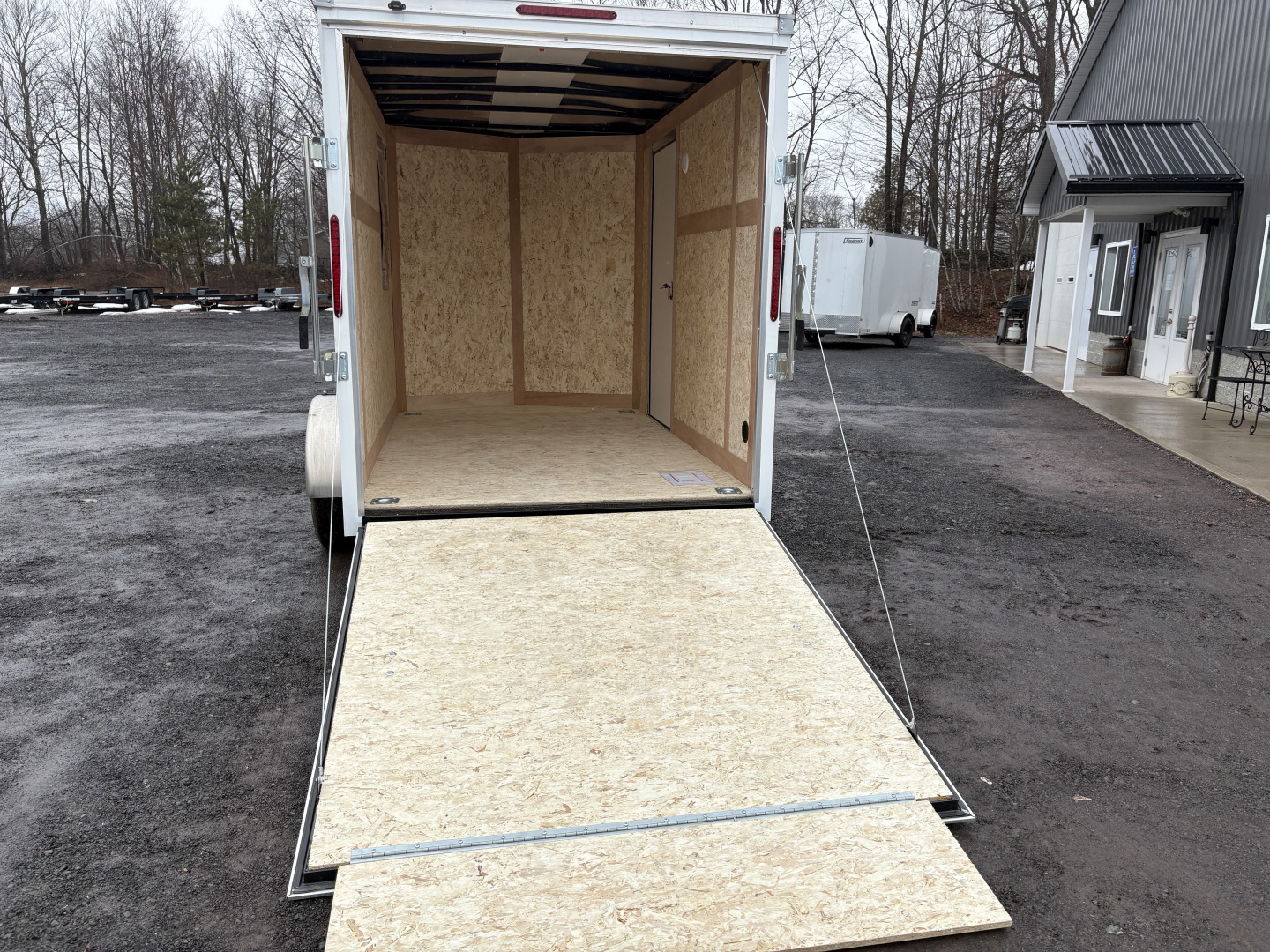 New 2026 Haulmark 6x10 6'6" Interior Passport Deluxe Cargo / Enclosed Trailer with Ramp Door