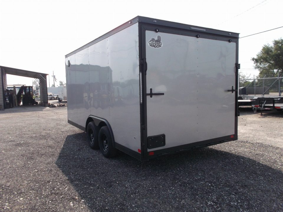 New 2026 Covered Wagon Trailers 8.5x16 Cargo Trailer / Car Hauler / 5200# Axles / 7ft Interior Height / 48" RV Side Door / Bed Lined RV Step / .080 Silver Semi-Screwless Exterior / 60" Triple Tube Tongue / Extra Wide Ramp / Black Out Package