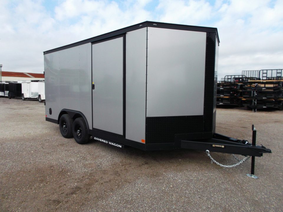 New 2026 Covered Wagon Trailers 8.5x16 Cargo Trailer / Car Hauler / 5200# Axles / 7ft Interior Height / 48" RV Side Door / Bed Lined RV Step / .080 Silver Semi-Screwless Exterior / 60" Triple Tube Tongue / Extra Wide Ramp / Black Out Package