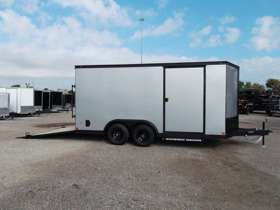 New 2026 Covered Wagon Trailers 8.5x16 Cargo Trailer / Car Hauler / 5200# Axles / 7ft Interior Height / 48" RV Side Door / Bed Lined RV Step / .080 Silver Semi-Screwless Exterior / 60" Triple Tube Tongue / Extra Wide Ramp / Black Out Package