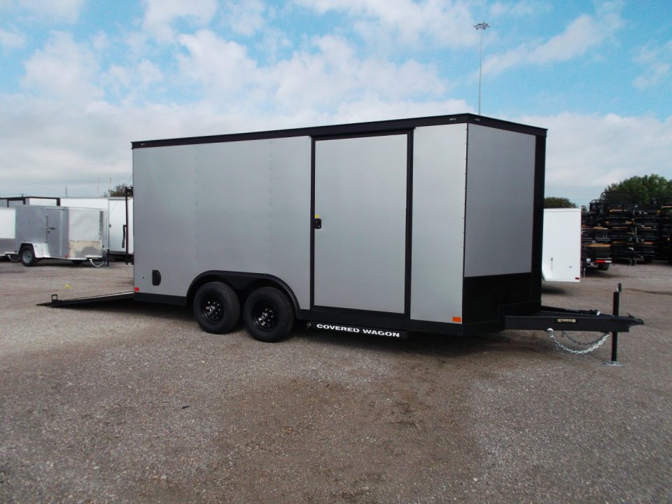 New 2026 Covered Wagon Trailers 8.5x16 Cargo Trailer / Car Hauler / 5200# Axles / 7ft Interior Height / 48" RV Side Door / Bed Lined RV Step / .080 Silver Semi-Screwless Exterior / 60" Triple Tube Tongue / Extra Wide Ramp / Black Out Package