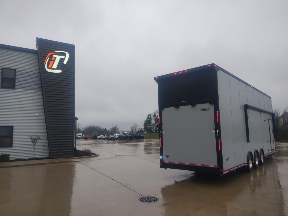 New In-Tech Lite 8.5x32 Stacker Race Trailer-21K- Sportsman Gray W/ Black Trim, Escape Door, WW Cabinet, L Cabinet, & Winch