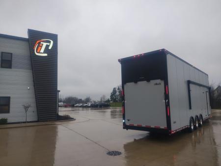 New In-Tech Lite 8.5x32 Stacker Race Trailer-21K- Sportsman Gray W/ Black Trim, Escape Door, WW Cabinet, L Cabinet, & Winch