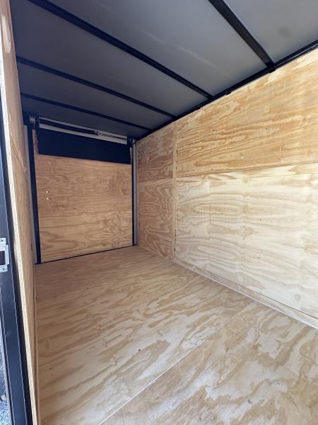 New 2026 6X12 SINGLE AXLE ENCLOSED TRAILER WITH REAR SPOILER, BLACKOUT PACKAGE AND 7' ROOF