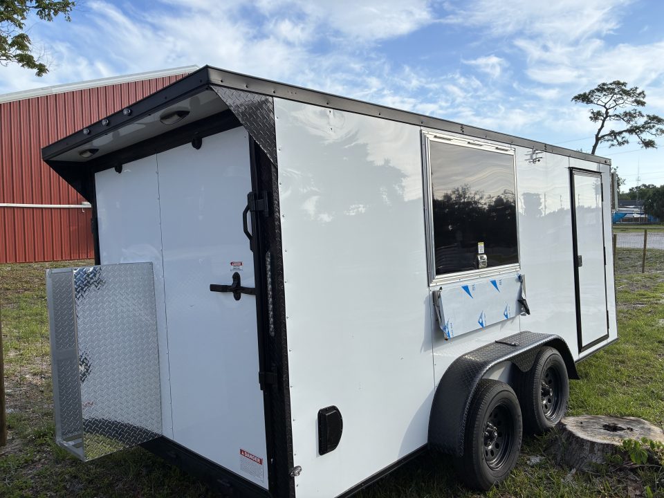 Used 2025 Cargo United LLC Food Truck 7 x 12 Dual Axle White with Blackout Package and Rear Wing with LED Lights Enclosed Trailer