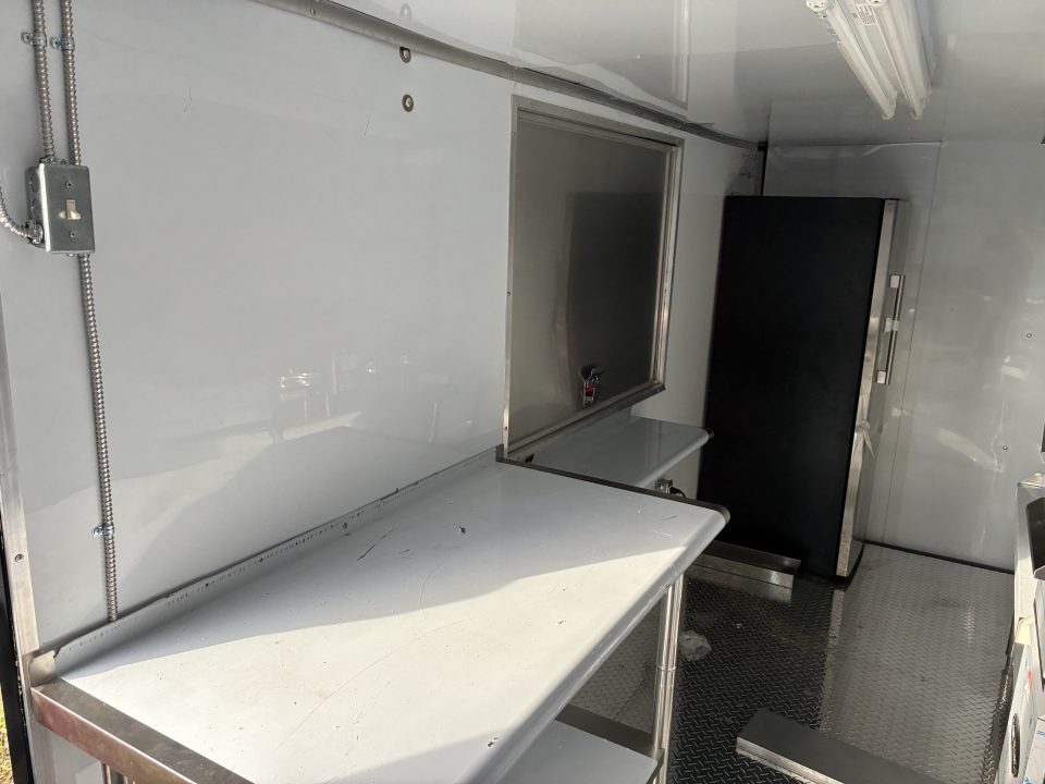 Used 2025 Cargo United LLC Food Truck 7 x 12 Dual Axle White with Blackout Package and Rear Wing with LED Lights Enclosed Trailer