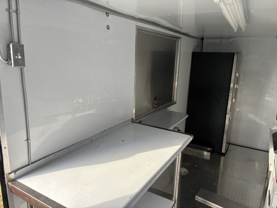 Used 2025 Cargo United LLC Food Truck 7 x 12 Dual Axle White with Blackout Package and Rear Wing with LED Lights Enclosed Trailer