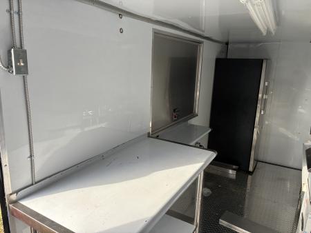 Used 2025 Cargo United LLC Food Truck 7 x 12 Dual Axle White with Blackout Package and Rear Wing with LED Lights Enclosed Trailer