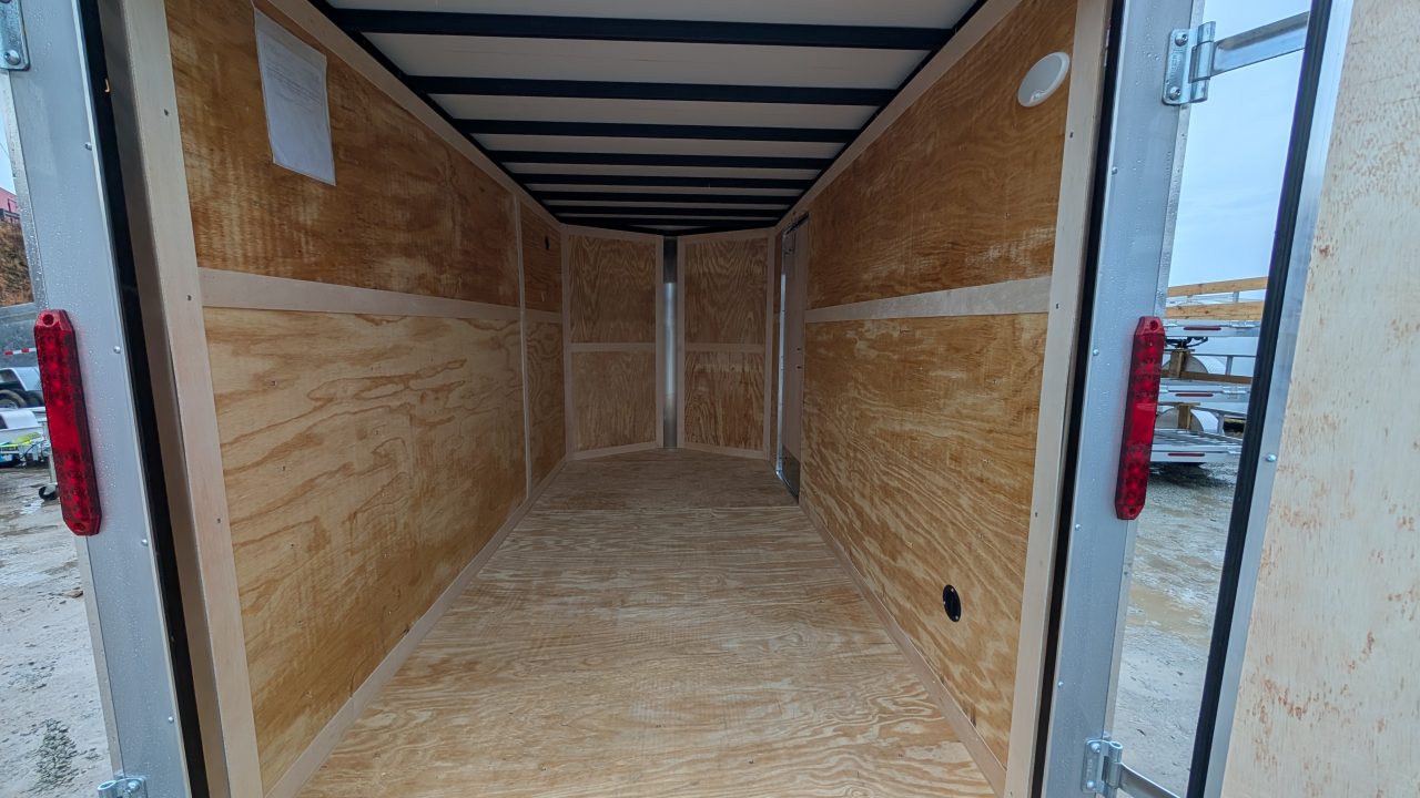 New 2026 Homesteader 6x10 Intrepid V-Nose Cargo Trailer w/ Barn Doors